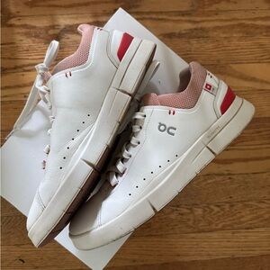 On Running White and Red Athletic Shoes